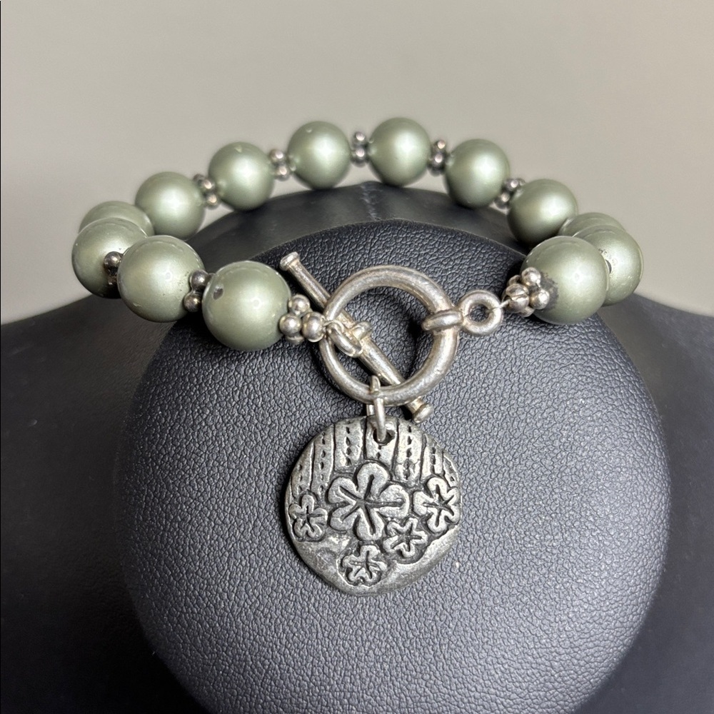 Green Beaded Bracelet with Silver Charm